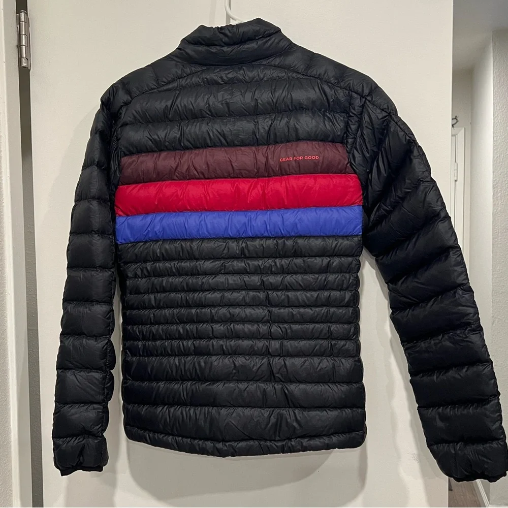 Cotopaxi Woman’s Down Fuego Black Jacket with Red & Blue Stripes - Picture 2 of 3